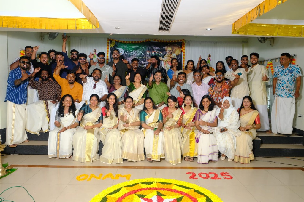 Award recipients holding plaques at the Vision India recognition ceremony