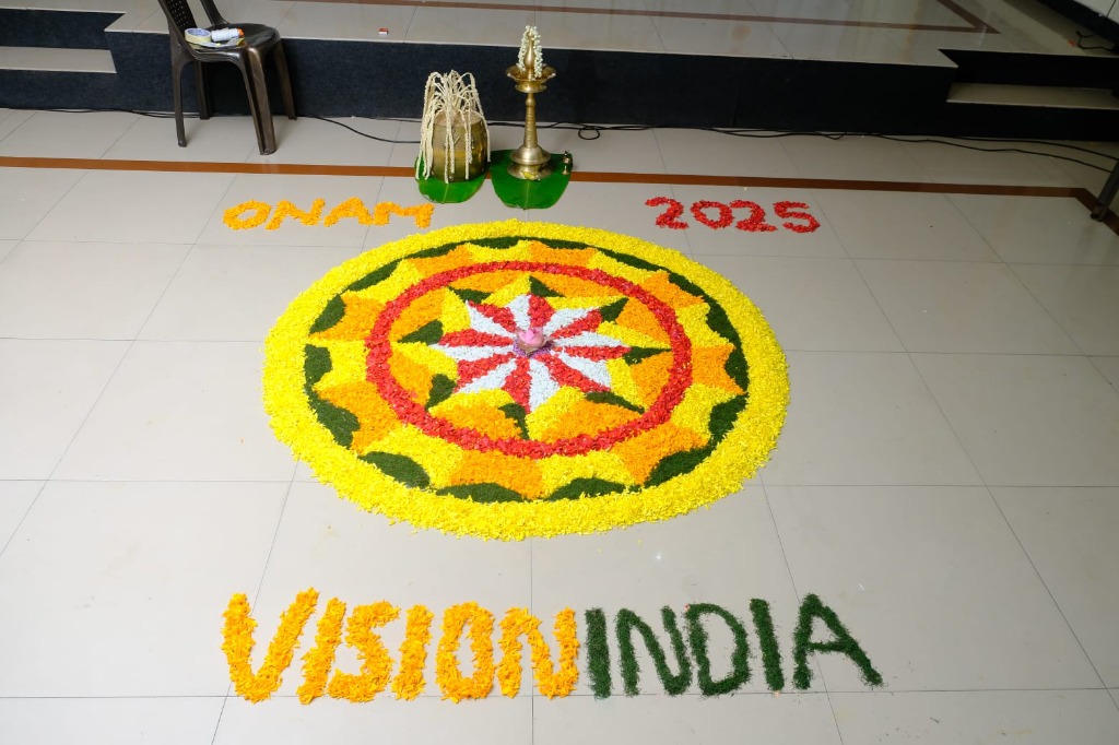 Traditional Onam Pookalam flower rangoli with Vision India branding